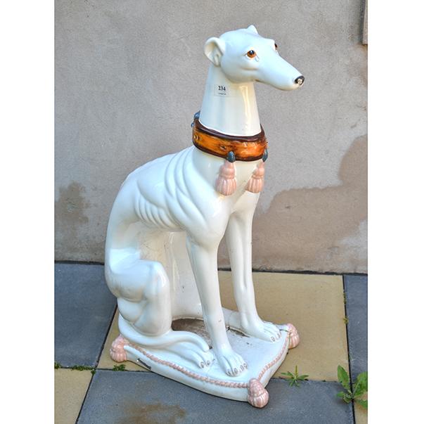 Appraisal: A GLAZED CERAMIC FIGURE OF A WHIPPET REPAIRED CM HIGH