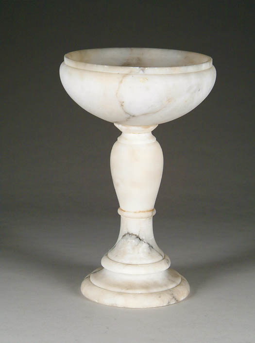 Appraisal: WHITE MARBLE COMPOTE Goblet shaped with turned shaft and round