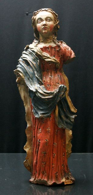 Appraisal: A polychrome painted terracotta figure of the Madonna damage cms