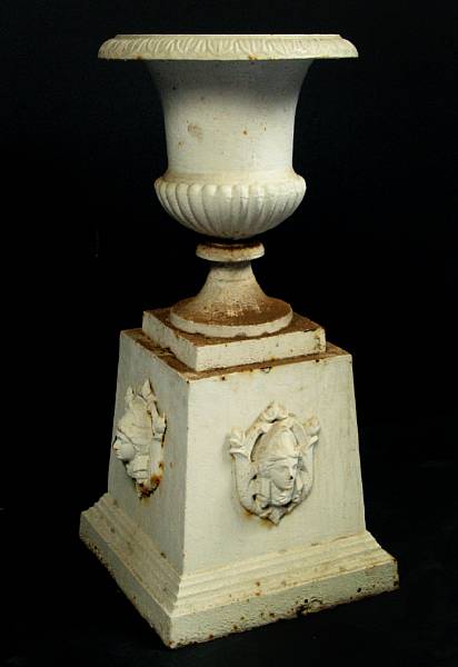 Appraisal: A white painted cast iron garden urn and pedestal rust