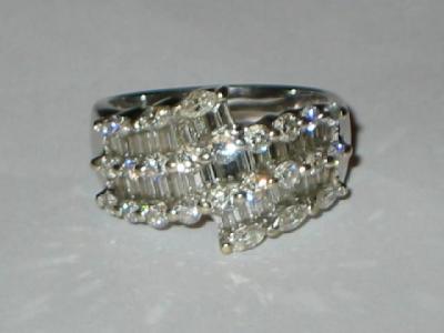 Appraisal: A DIAMOND DRESS RING of half hoop eternity form set