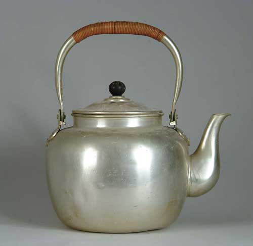 Appraisal: LARGE SWING HANDLE ALUMINUM WATER KETTLE Rattan wrapped swing handle