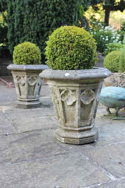 Appraisal: A SET OF THREE HADDONSTONE OCATGONAL GOTHIC STYLE VASE PLANTERS