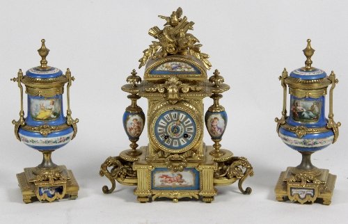 Appraisal: A th Century gilt spelter and porcelain matched clock garniture