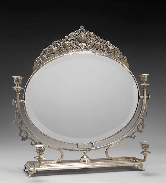 Appraisal: A Persian standard silver lady's dressing table mirror with four