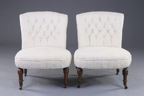 Appraisal: PAIR VICTORIAN SLIPPER CHAIRS late th century walnut Cream button-tufted