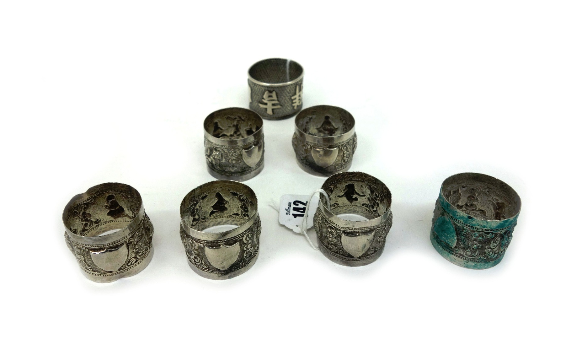 Appraisal: A Chinese silver napkin ring with a calligraphic inscription and