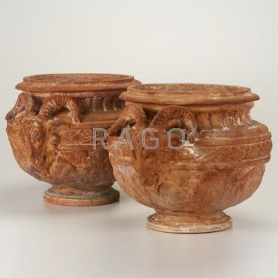 Appraisal: TERRA-COTTA PLANTERS Pair in traditional Greek form with applied rams