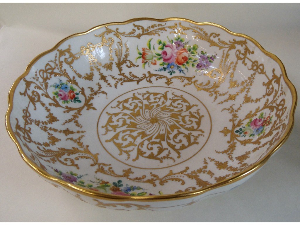 Appraisal: French porcelain bowl with gilt decoration and vignettes painted with