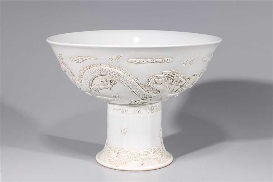 Appraisal: Chinese white porcelain serving dishes with dragons and flaming pearl