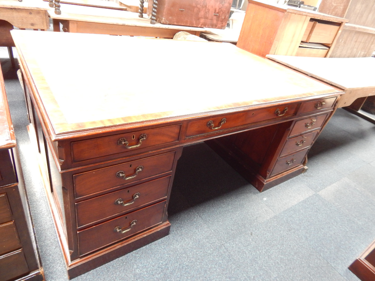 Appraisal: A Georgian style mahogany pedestal desk having three frieze drawers