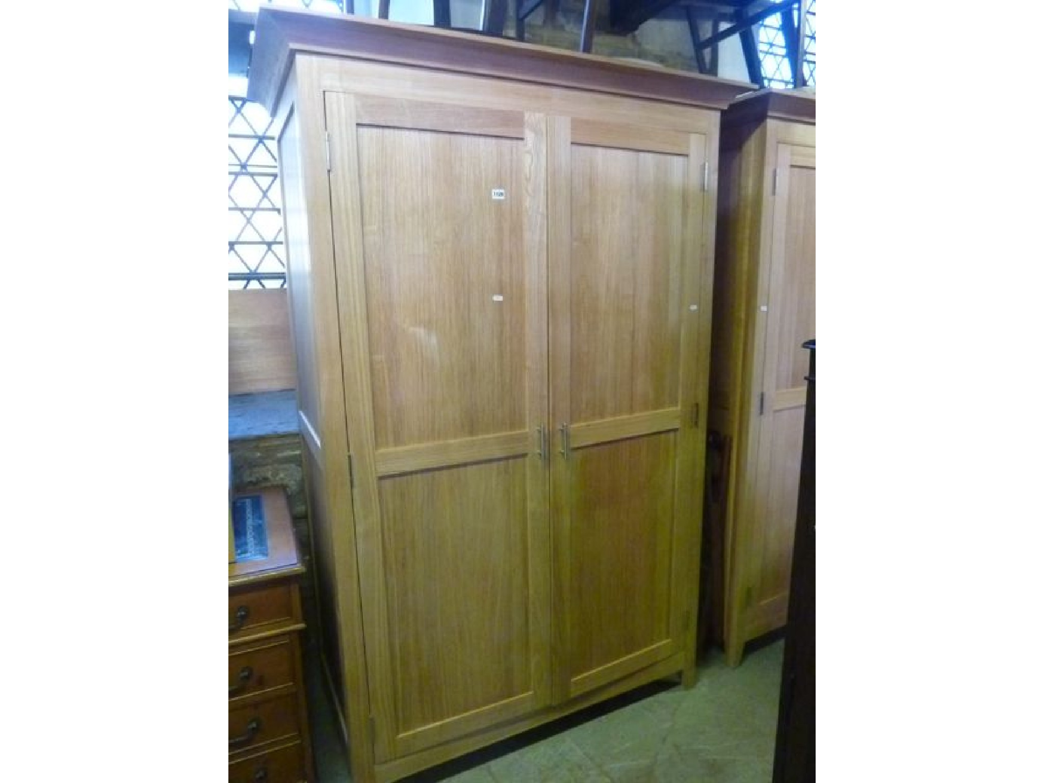 Appraisal: A good quality contemporary light oak bedroom pair comprising wardrobe