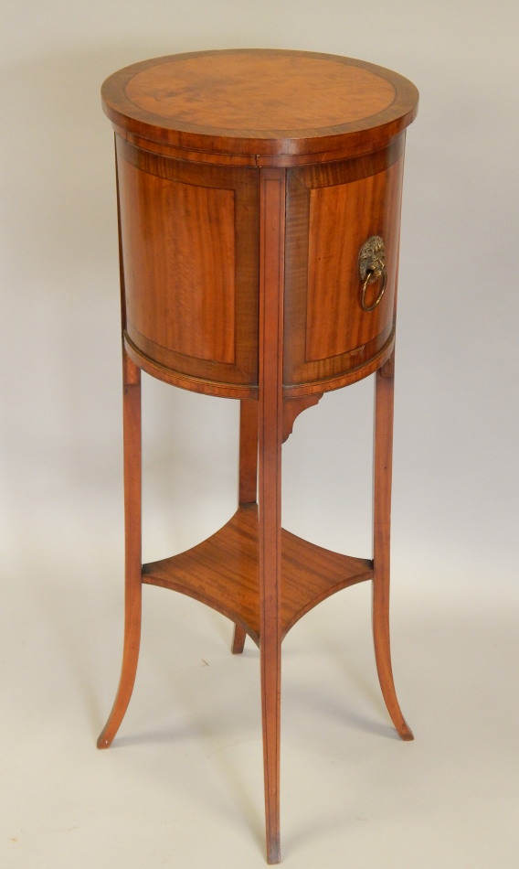 Appraisal: An Edwardian satinwood jardiniere the cylindrical top with a loose