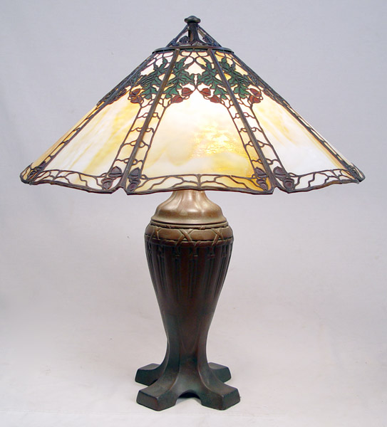 Appraisal: LARGE ACORN PANEL HANDEL LAMP Large acorn metal filigree shade