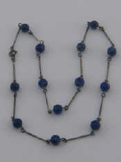 Appraisal: A white metal tests silver lapis lazuli bead necklace beads