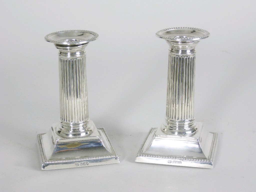 Appraisal: Pair of George V Candlesticks with fluted columns having beaded