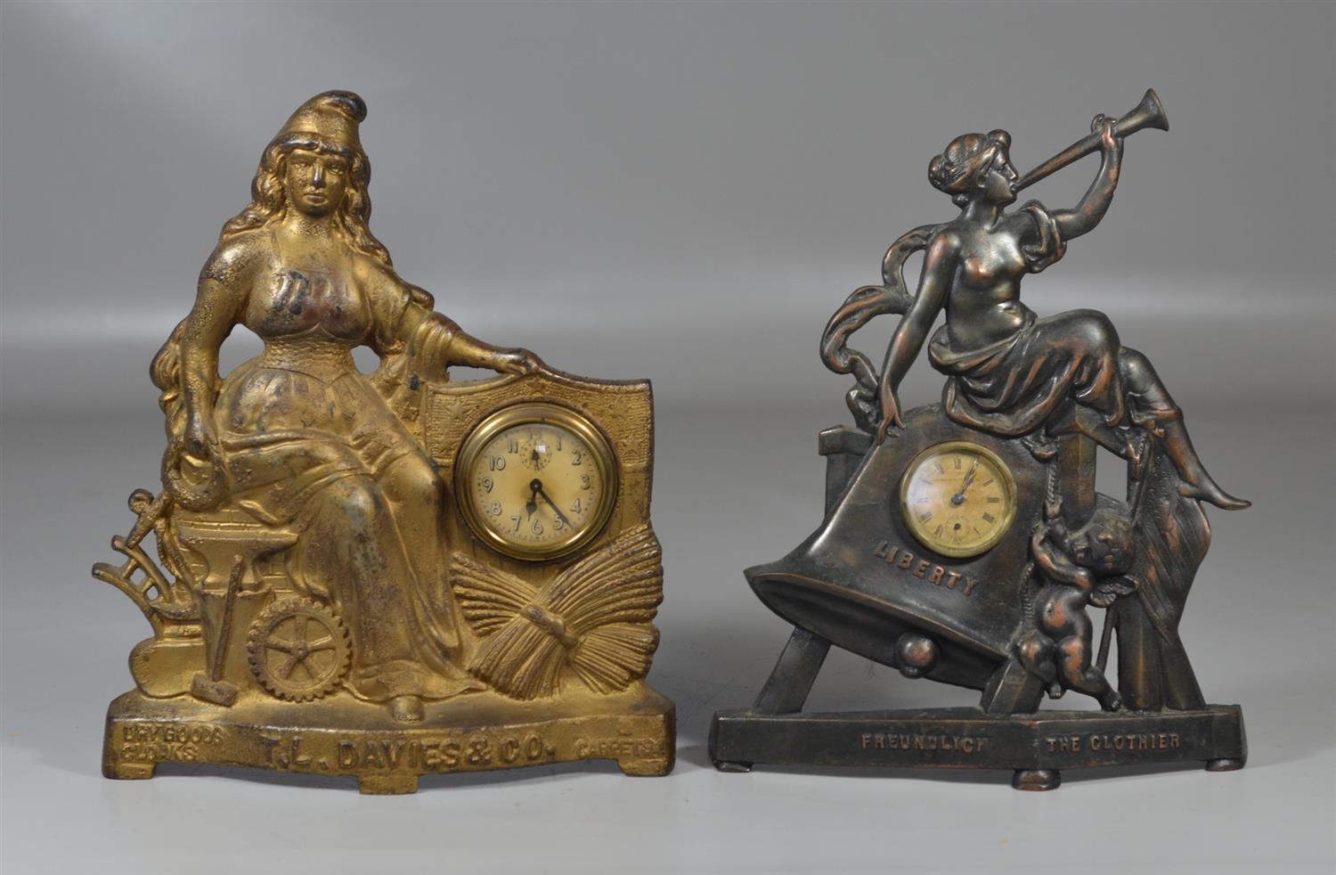 Appraisal: Cast iron figural advertising clocks TL Davies Company Carpets Dry