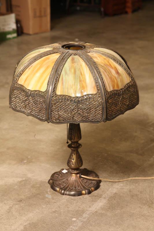 Appraisal: TABLE LAMP Pierced metal shade with slag glass panels on