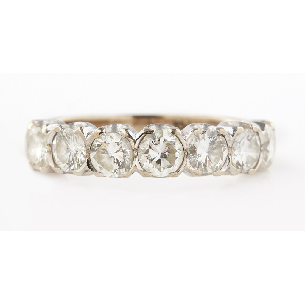 Appraisal: A seven stone diamond ring claw set with seven round