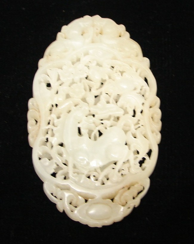 Appraisal: Openwork jade carving in oval form featuring deer motif with