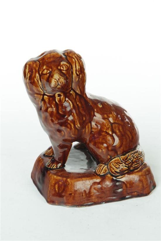 Appraisal: ROCKINGHAM DOG American nd half- th century Seated spaniel with