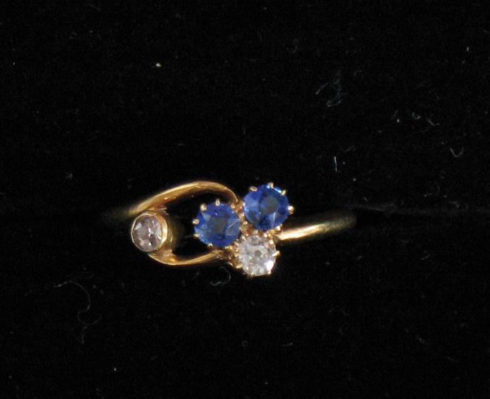 Appraisal: A CHILD'S SAPPHIRE AND DIAMOND RING the yellow gold twisted