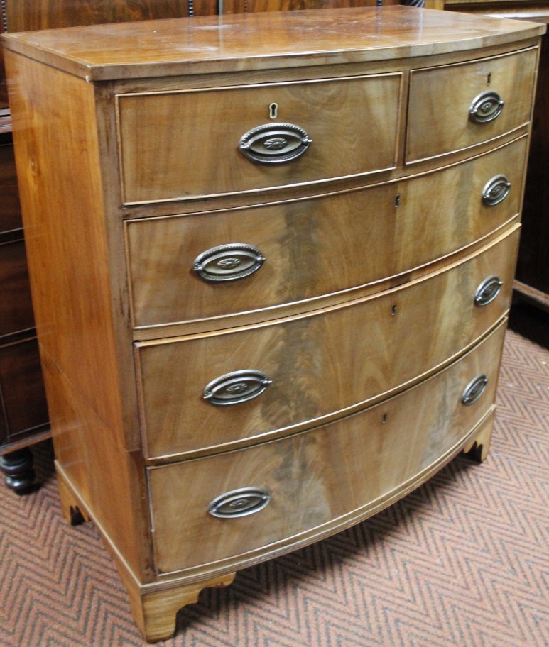 Appraisal: A thC mahogany bow front chest set with two short