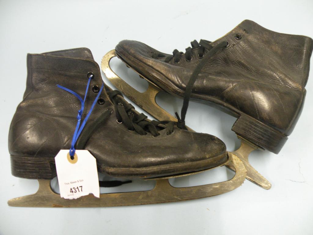 Appraisal: A pair of leather and steel ice skates the blades