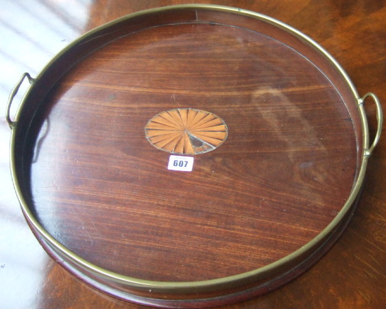 Appraisal: A th century mahogany serving tray with brass bound gallery