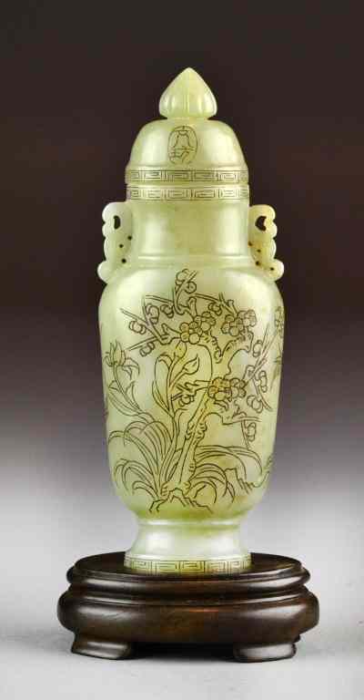 Appraisal: Chinese Carved Celedon Jade Vase and CoverCarved to depict lotus