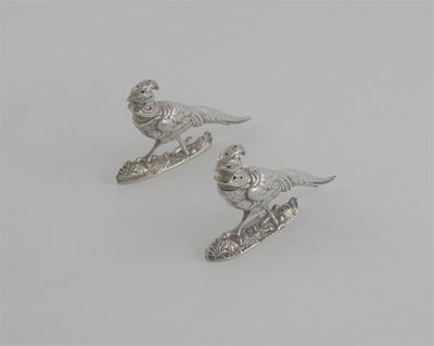 Appraisal: A pair of Victorian novelty pepperettes modelled as Chinese pheasants