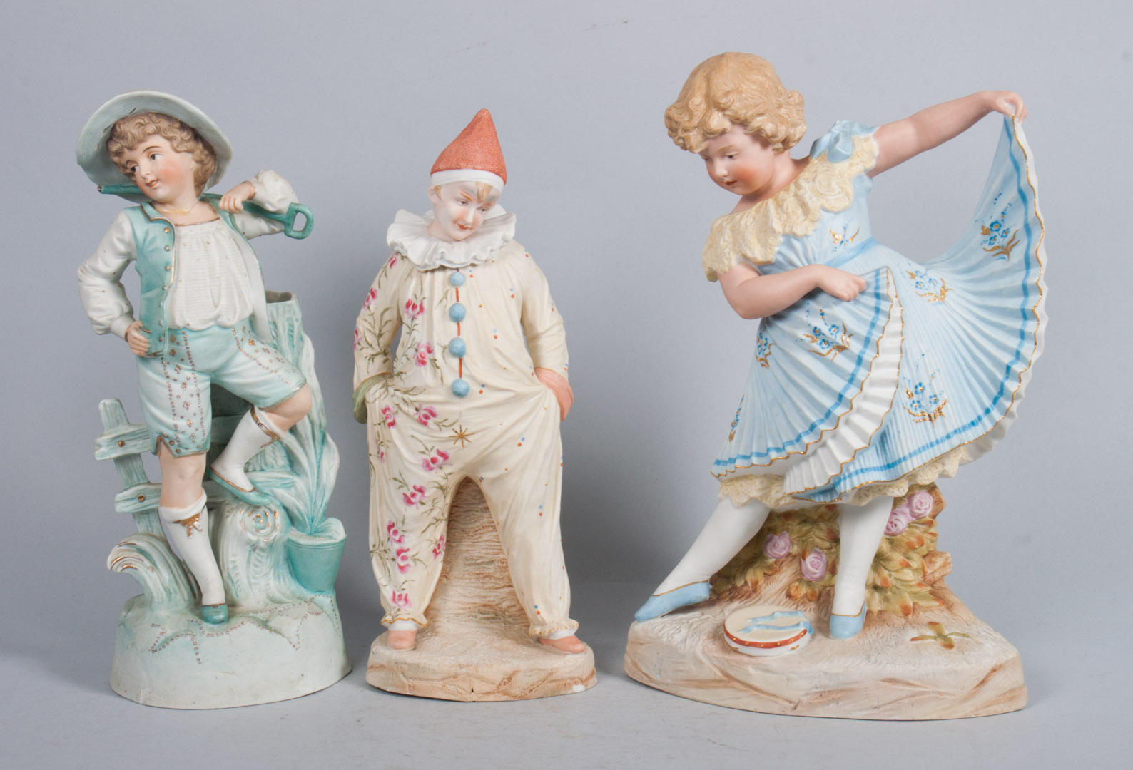 Appraisal: Three German painted bisque figures late th early th century