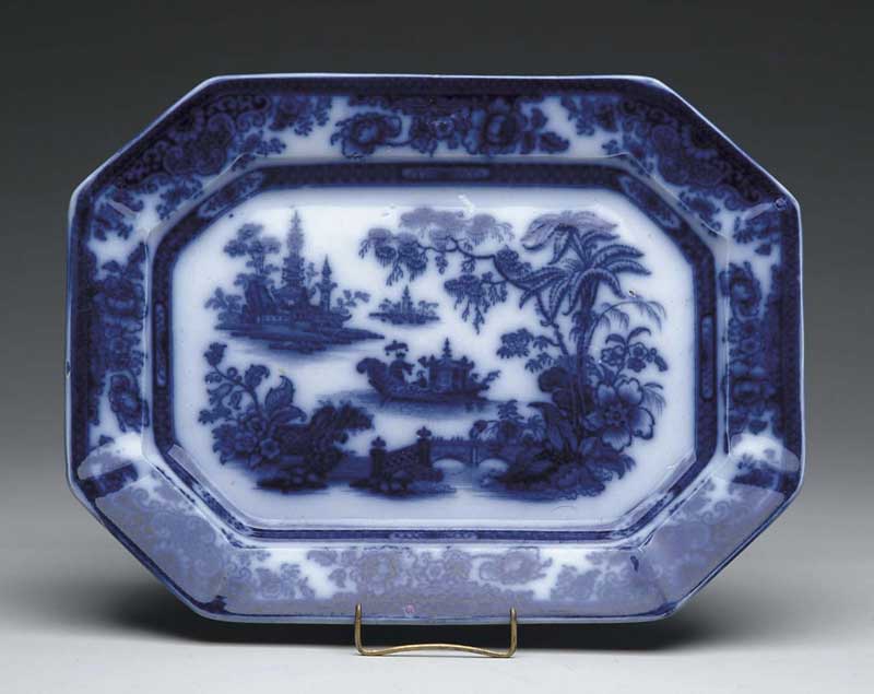 Appraisal: FLOW BLUE PLATTER IN THE TONQUIN PATTERN Cut corner platter