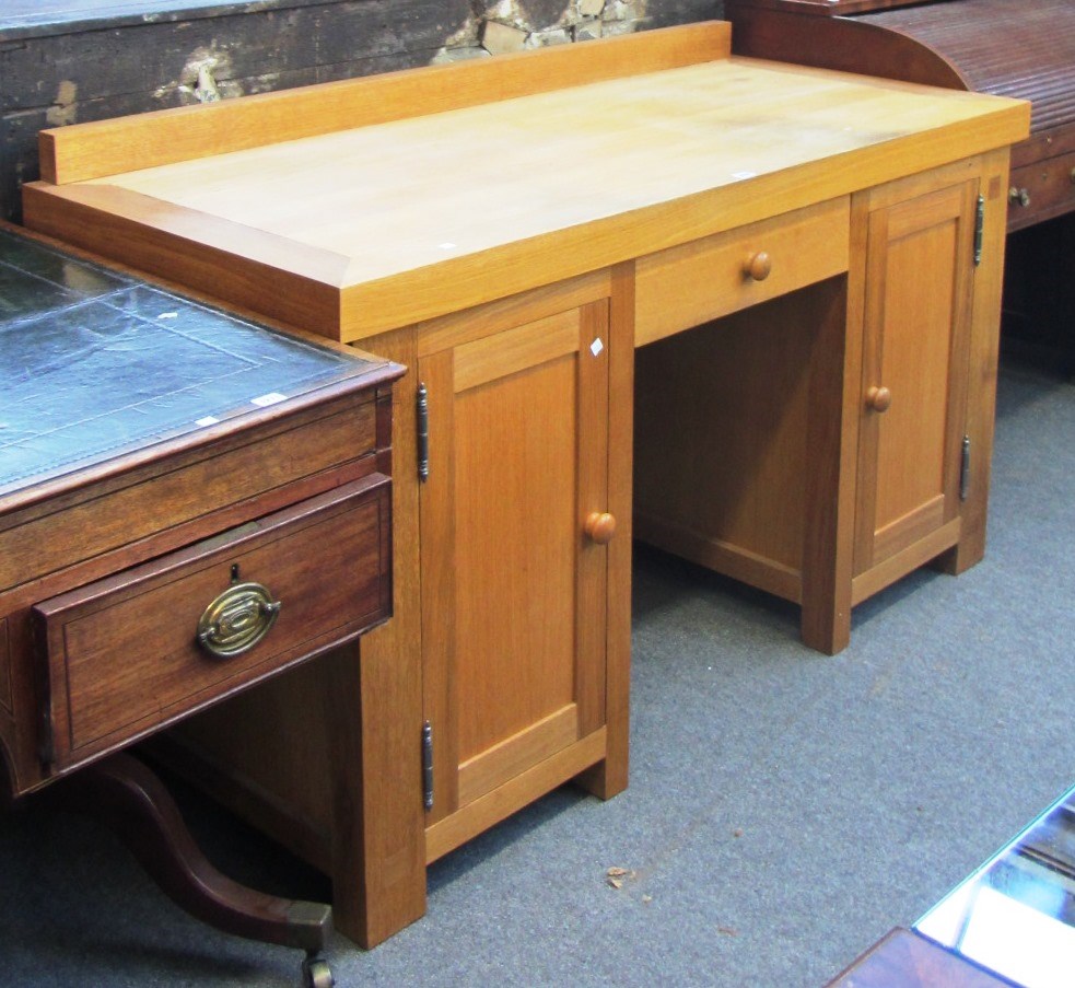 Appraisal: A th century light oak kneehole desk cm wide together