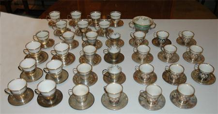 Appraisal: Group of Sterling Silver Demitasse Cups with Porcelain Liners Estimate