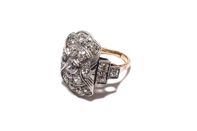 Appraisal: A gold and platinum diamond set panel shaped cluster ring