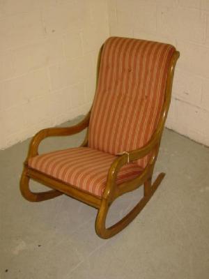 Appraisal: A VICTORIAN MAHOGANY FRAMED ROCKING CHAIR button upholstered in striped