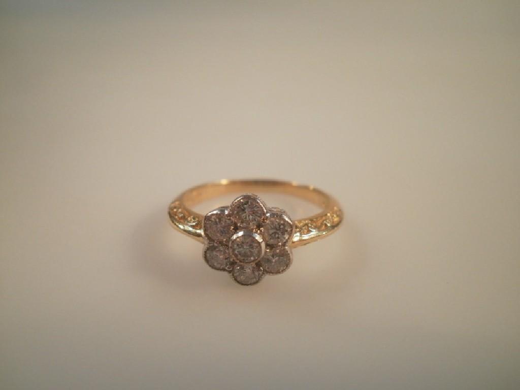 Appraisal: A seven stone diamond floral cluster ring stones totalling approx