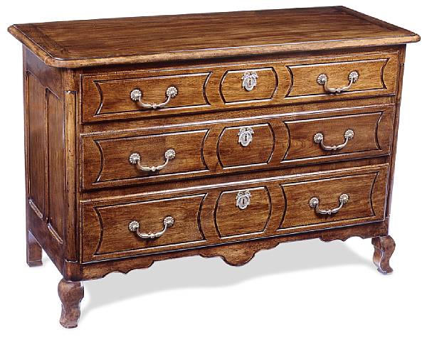 Appraisal: A French Provincial style walnut commode Fitted with three long