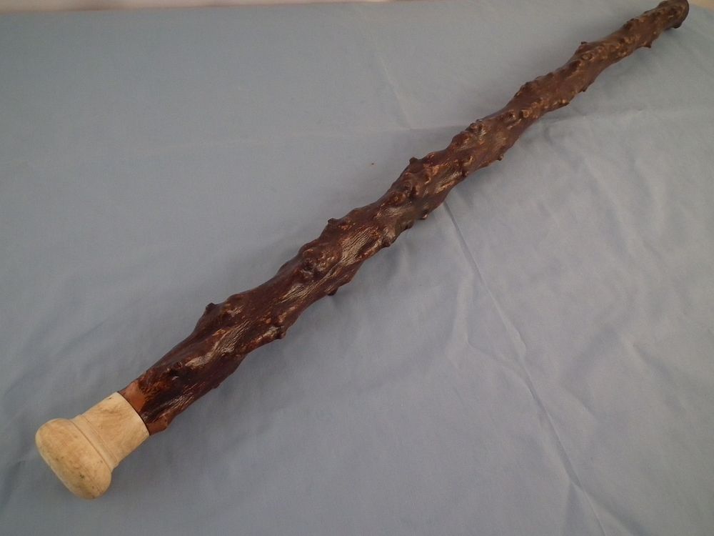 Appraisal: ANTIQUE BONE WOOD CANE th century heavy wood cane thorny