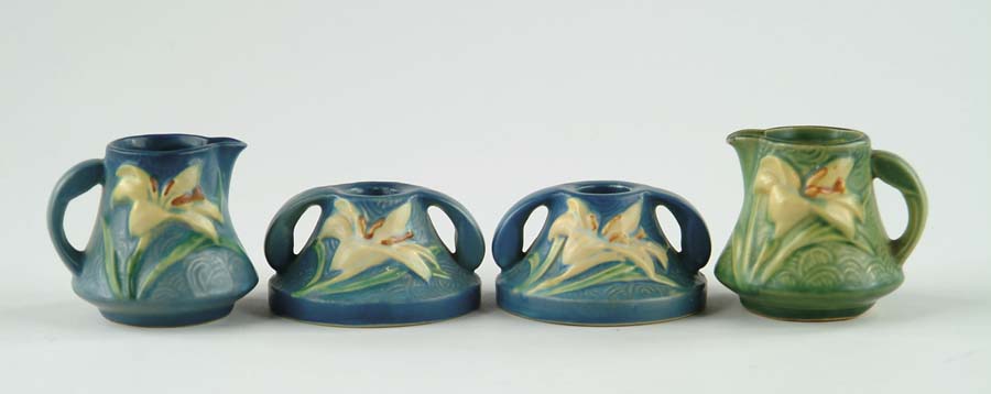 Appraisal: FOUR PIECES OF ROSEVILLE POTTERY Pair of matte blue Zephyr