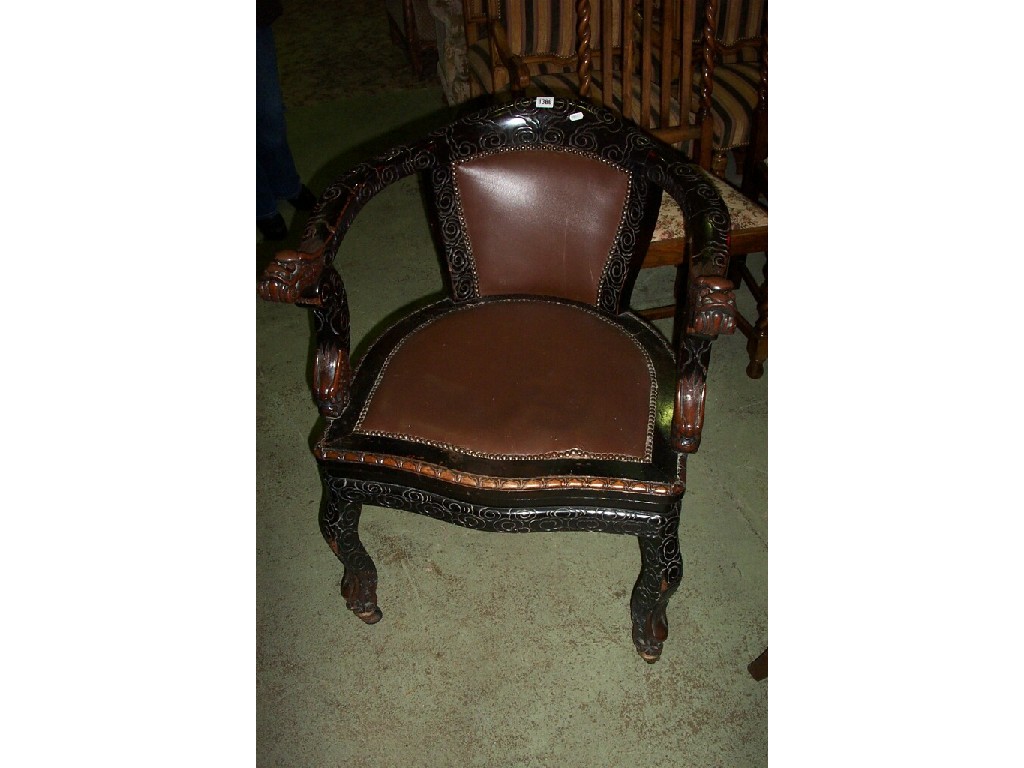 Appraisal: A Chinese hardwood open armed elbow chair with dragon head