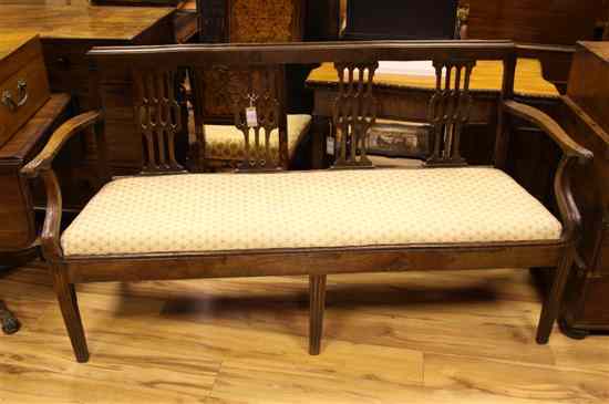 Appraisal: A th century French cherrywood chair back sofa with four