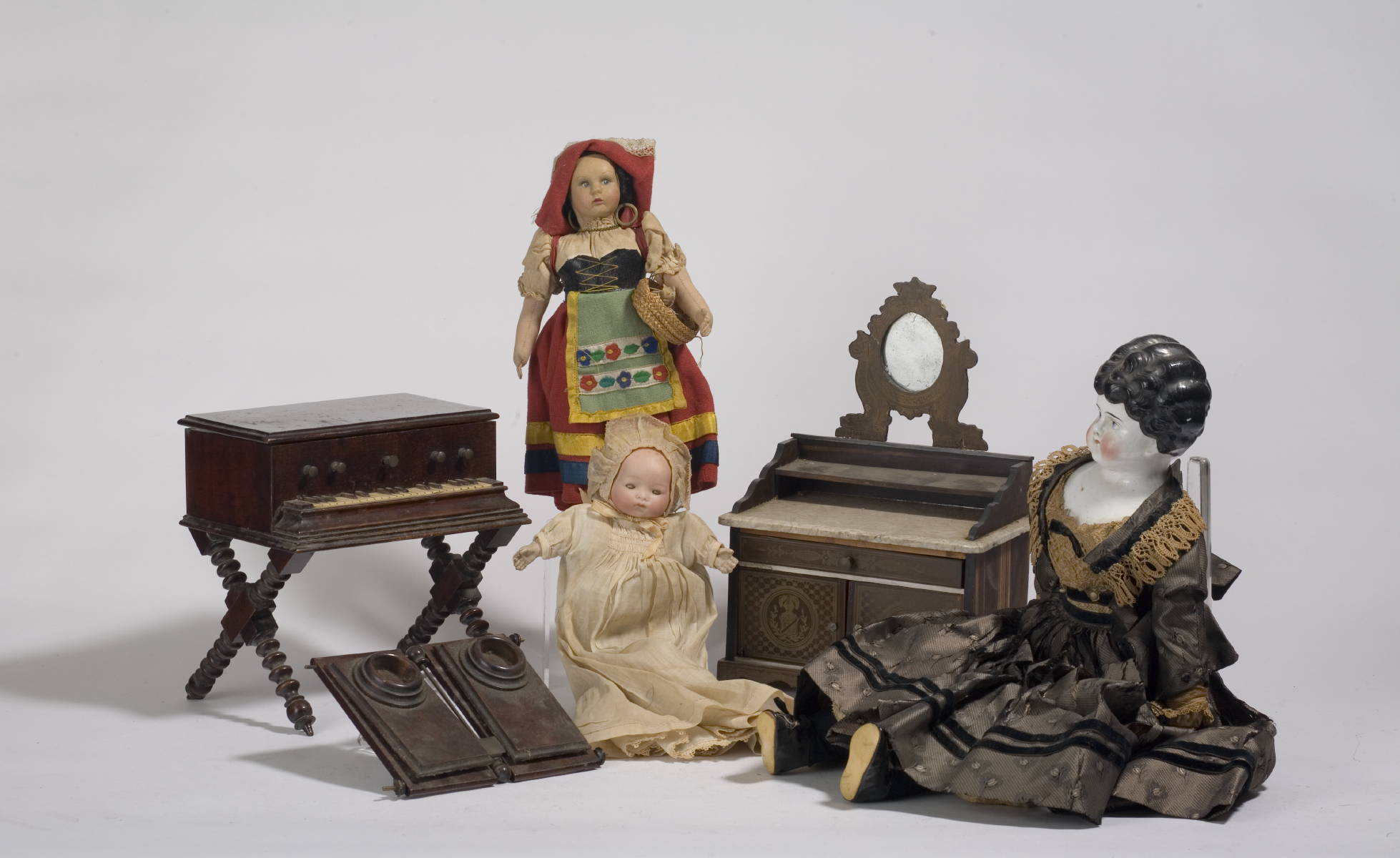 Appraisal: THREE DOLLS INCLUDING A CHINA HEAD EXAMPLE AND A BISQUE