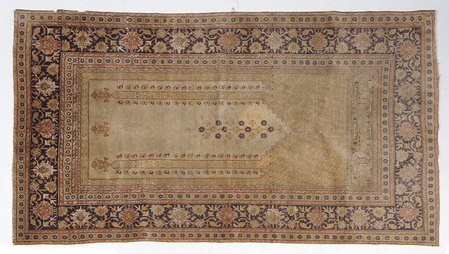 Appraisal: AN OLD TURKISH PASTEL GROUND PRAYER RUG with simple foliate