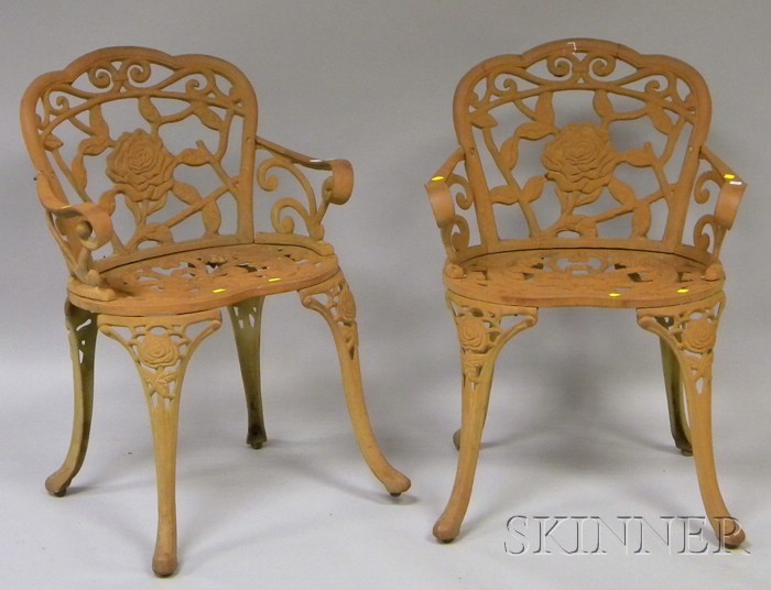 Appraisal: Pair of Painted Cast Iron Rose Pattern Garden Armchairs late