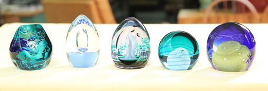 Appraisal: FIVE CAITHNESS PAPERWEIGHTS Aqua blue having an interior human figure