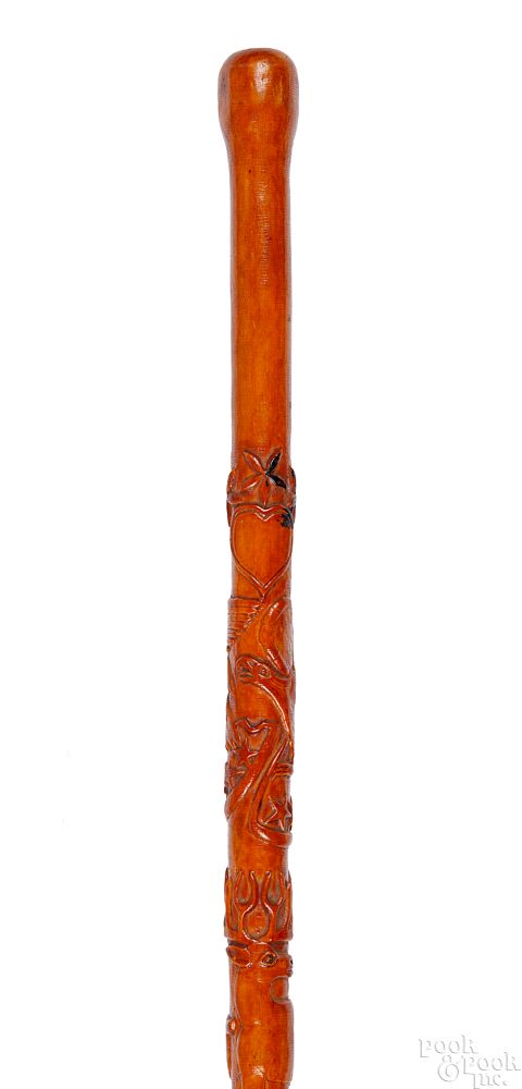 Appraisal: Pennsylvania carved cane Pennsylvania carved cane late th c decorated