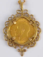 Appraisal: A loose mounted gold sovereign pendant on a carat gold