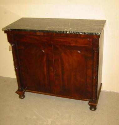 Appraisal: A MAHOGANY CHIFFONIER with later black veined marble top overhanging